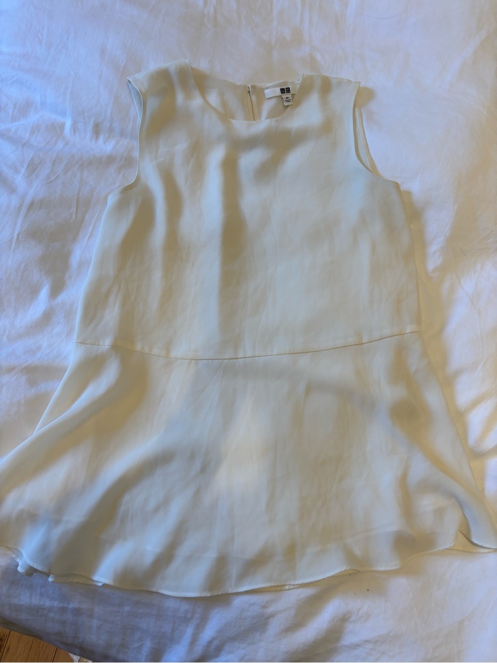 Uniqlo Cream Sleeveless Peplum Top